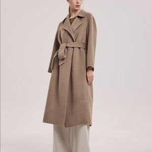 Featuring a double face wool, waist tie detail, woolly longline coat styled.